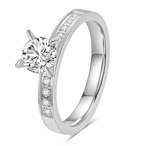 Macro view of a 3mm silver zircon ring featuring a classic four-prong set round diamond
