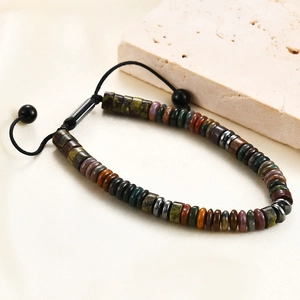Detail of adjustable drawstring bracelet with tiger eye and aventurine stone beads