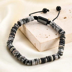 Detail of adjustable men's beaded bracelet with grey marble stones and black disc spacers