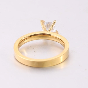 Detail view of 3mm gold-plated zircon ring showing classic 4-prong setting and flat band