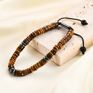 Detail of tiger eye beads and braided cord with adjustable sliding knot closure
