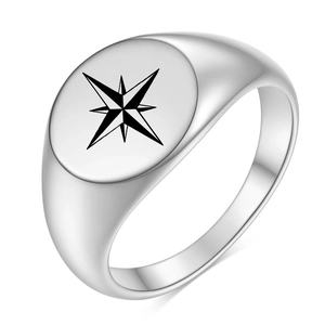 Polished silver signet ring with black etched octagonal star compass on a flat oval face