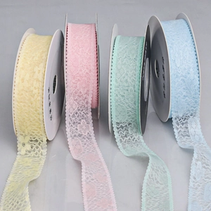 Four rolls of floral lace ribbon in pastel colors for DIY hair bows and dress decoration