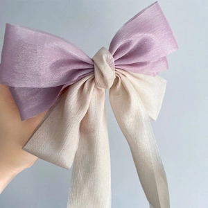 Elegant cream and lavender double-layer mesh bow hair clip with a delicate wrinkled texture