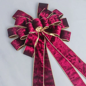 Velvet burgundy Christmas bow with gold edges for tree decoration and gift wrapping