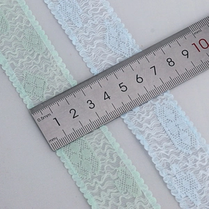 Lace ribbon with mesh flower embroidery in mint green and light blue colors