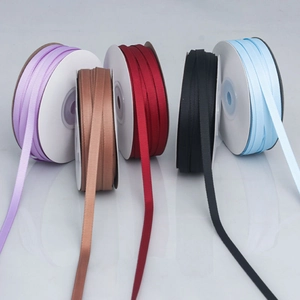 Close-up showing various colors of 2.5cm ribbed polyester grosgrain ribbons for DIY crafts