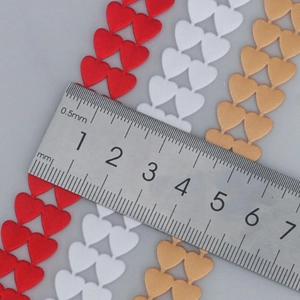 Double-layer heart shaped polyester ribbons in red white and gold for gift wrapping