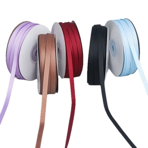 Five-color ribbed polyester ribbons on white spools for DIY crafts and gift packaging