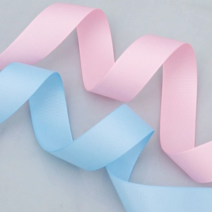 Pink and blue grosgrain ribbons with textured surface for gift wrapping and DIY crafts