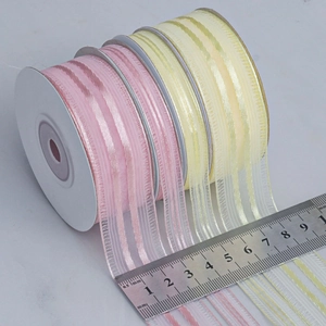 Vertical striped sheer chiffon ribbons in pink and yellow with scale for width measurement