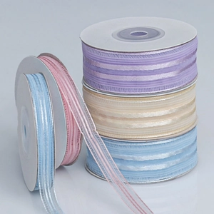 Detailed close-up of multi-colored vertical striped sheer organza ribbon rolls for DIY