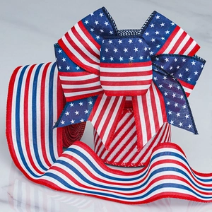 Detailed view of patriotic US flag patterned ribbon bows on a gray marble background
