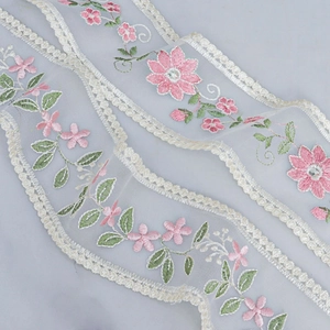 Pink floral embroidery lace ribbon with green leaves and white wavy scalloped edges