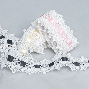 Detail of 4.5cm wavy polyester lace trim with colorful satin ribbons for DIY crafts