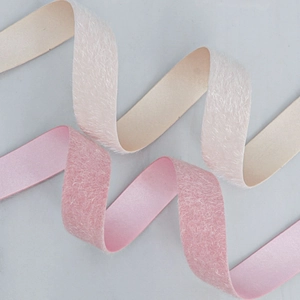 Lush feather-textured velvet ribbon with silk satin back in cream and soft pink colors