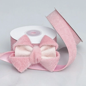 Premium pink faux fur ribbon roll and handmade bow with soft fluffy texture for DIY crafts