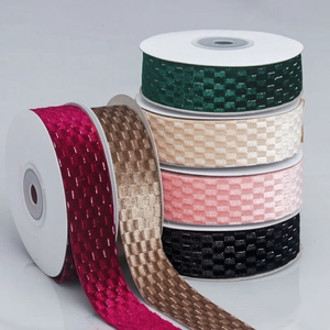 Close-up of velvet checkered ribbon with metallic silver threads for DIY gift wrapping