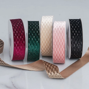 Detailed texture of checkered velvet ribbon in burgundy, green, ivory, pink and black
