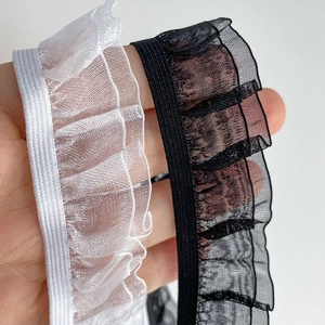 Macro shot of 2.5cm double-layer ruffled elastic lace trim in black and white
