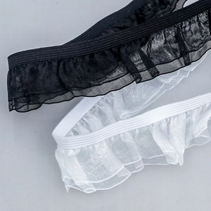 Macro detail of black and white 2.5cm double-layered ruffled elastic lace trim for sewing