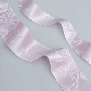 Elegant lavender silk ribbon with white floral patterns for DIY crafts and gift wrapping