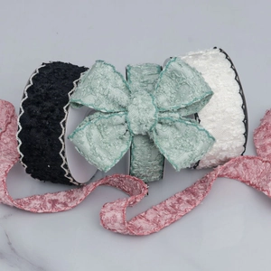 DIY knitting ribbon rolls with scalloped edges in black, white, green and pink colors