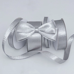 Silver metallic glitter ribbon rolls in various widths for DIY crafts and gift wrapping