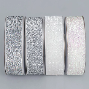 Set of four rolls of silver sparkling velvet ribbons for gift wrapping and DIY crafts