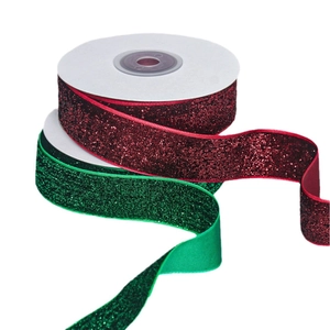 Glittering velvet ribbons in red and green for Christmas gift wrapping and DIY crafts