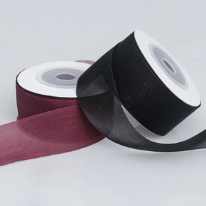 Detail view of 2.5cm wide semi-transparent burgundy and black matte organza ribbons