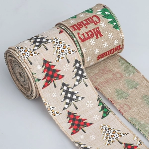 Detail of faux linen Christmas ribbon featuring snowflake patterns and wire edges