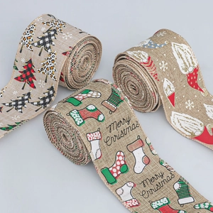 Close-up of three faux linen Christmas ribbons with gnomes, trees and Merry Christmas text