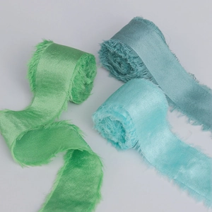Frayed edge silk-like satin ribbons in sage green and blue for wedding bouquet wrapping