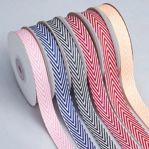Detailed macro view of multi-color herringbone cotton ribbons for DIY crafts