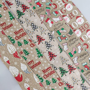 6.5cm faux linen Christmas ribbons with wired edges and festive Santa Claus prints