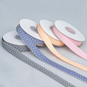 Close-up of four-color herringbone cotton ribbons for DIY crafts and gift wrapping