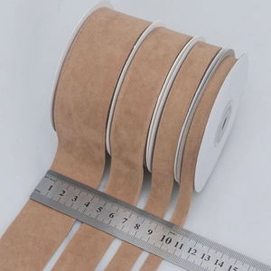 Brown velvet ribbons in four widths on white spools for DIY sewing crafts and gift wrapping