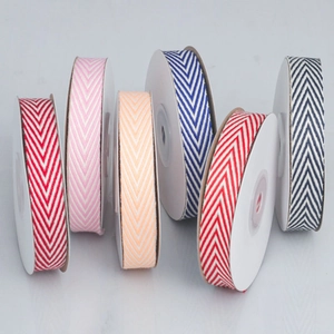 Close-up of herringbone cotton ribbons in six colors for DIY bows and gift wrapping