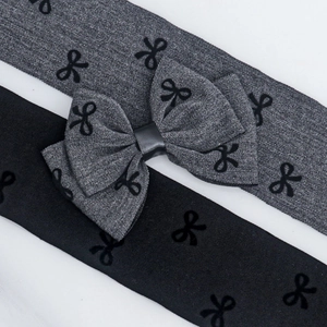 Detail of 5cm grey denim texture bow ribbon with black flocked pattern for DIY hair crafts
