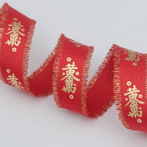 Red silk ribbon with gold longevity print and fringe edges for gift wrapping