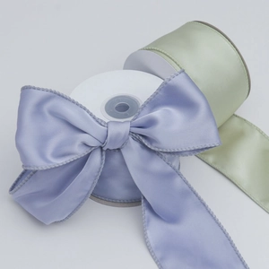 Detail of 6cm satin ribbon bows in lavender and light green with wired edges for DIY