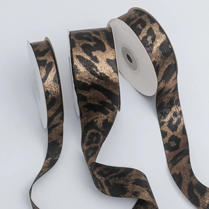 Three rolls of black and gold metallic leopard print ribbons in various widths for DIY crafts