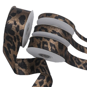Rolls of leopard print ribbon with gold stamping for DIY crafts and hair accessories