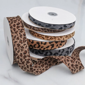 Close-up of leopard print velvet ribbons with soft flocked texture for DIY craft projects
