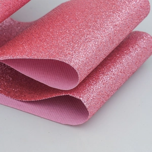 Macro shot of pink glitter PU leather fabric with a honeycomb woven texture backing