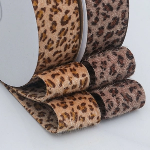 Leopard print faux fur ribbon rolls in warm gold and cool grey for DIY hair accessories