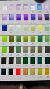 Detailed color chart showing various satin ribbon shades with official codes and names