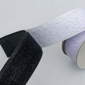 Macro view of nylon hook and loop fastener tape rolls showing texture and weaving detail