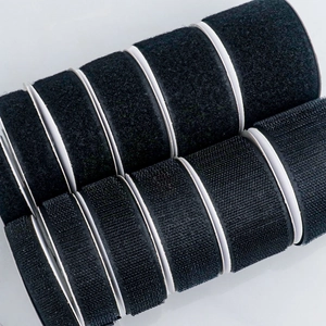 Self-adhesive hook and loop cable organizers in black rolls for cord management